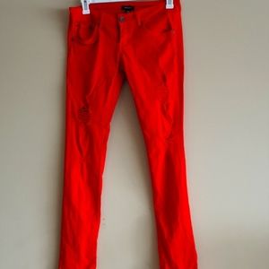 Distressed denim tangerine skinny jeans